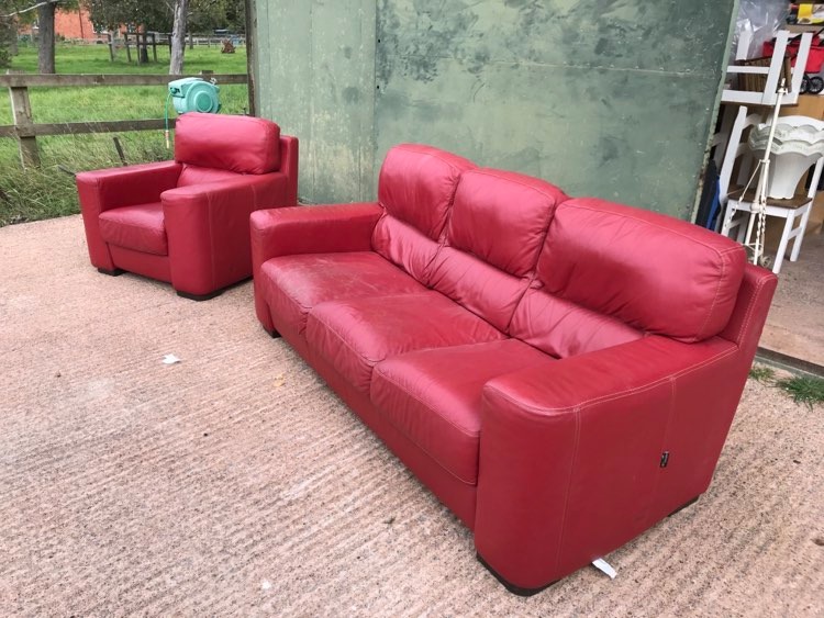 Lovely Italian Red Leather Sofa and matching chair by nicoline. Sofa is 86" long, 33" tall, 39" deep. Chair is 39" wide. The sofa base cushions have some minor age cracking so would benefit with a treatment with some coloured leather food to bring them back to life.